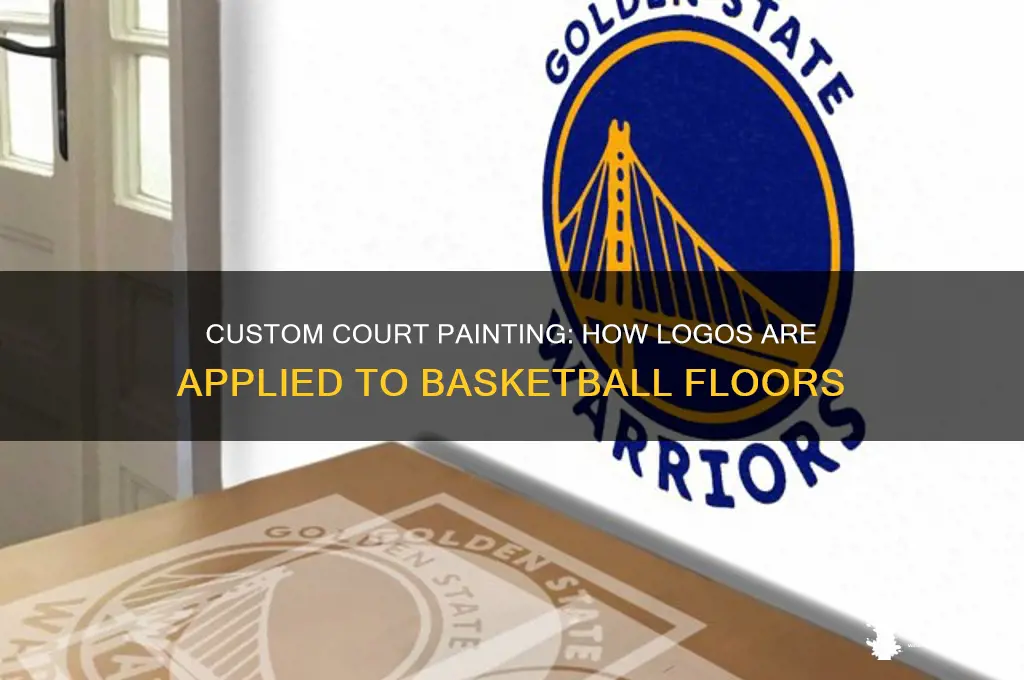 how do they paint logos on basketball courts