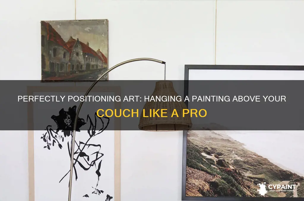 how to hang a painting above a couch