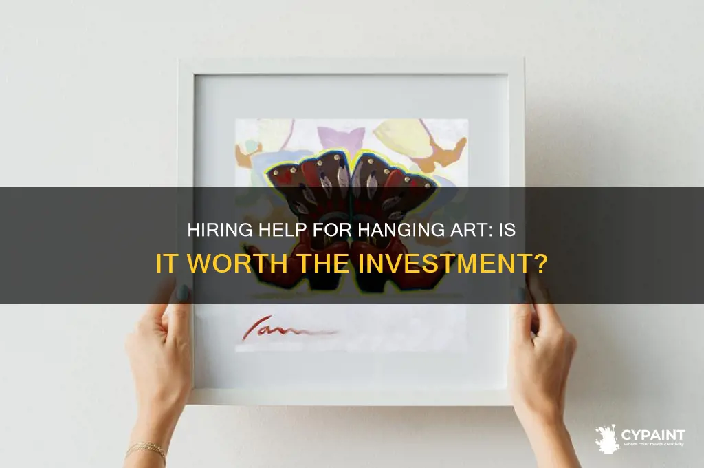 should i hire someone to hang a painting