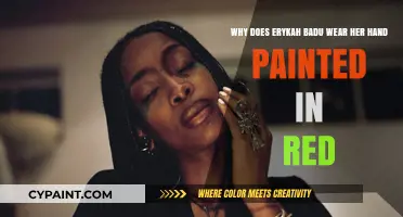 The Artistic Expression Behind Erykah Badu's Red-Painted Hand