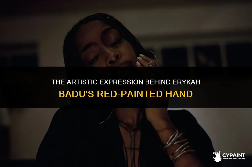 why does erykah badu wear her hand painted in red